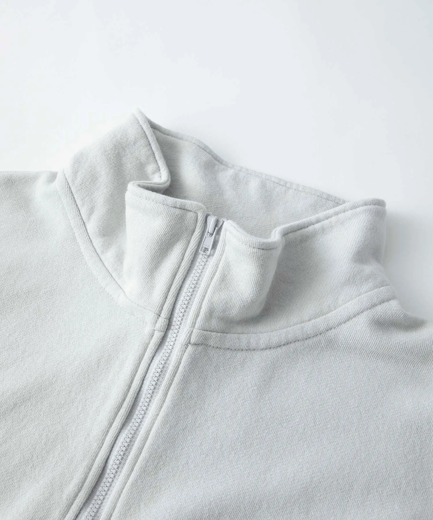 EMBROIDERY LASER HALF ZIP SWEAT