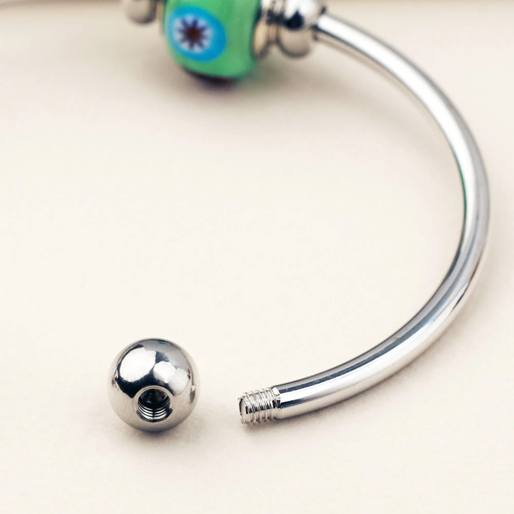 The Kiss Charm Bangle